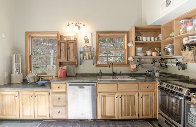 kitchen featuring visible vents, open shelves, a sink, light brown cabinetry, and stainless steel appliances