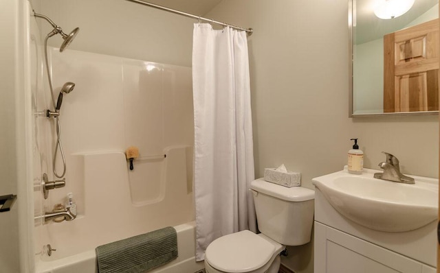 full bathroom with shower / bath combination with curtain, toilet, and vanity