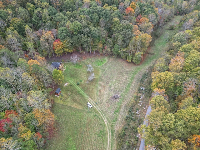 drone / aerial view featuring a view of trees