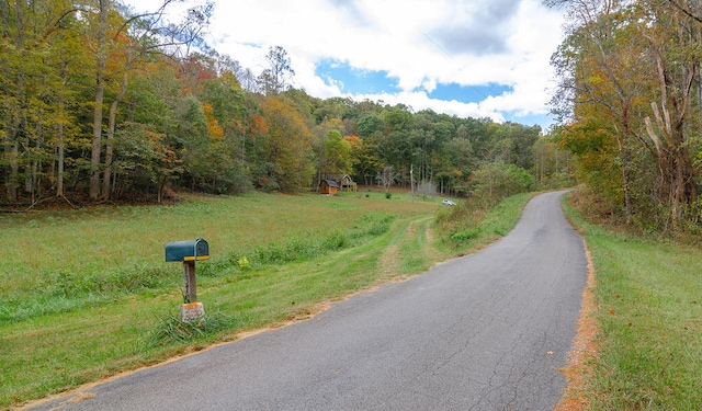 view of street with a wooded view