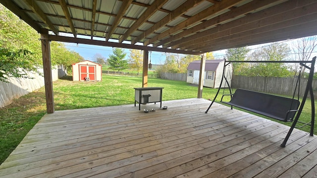 deck featuring a lawn and a shed