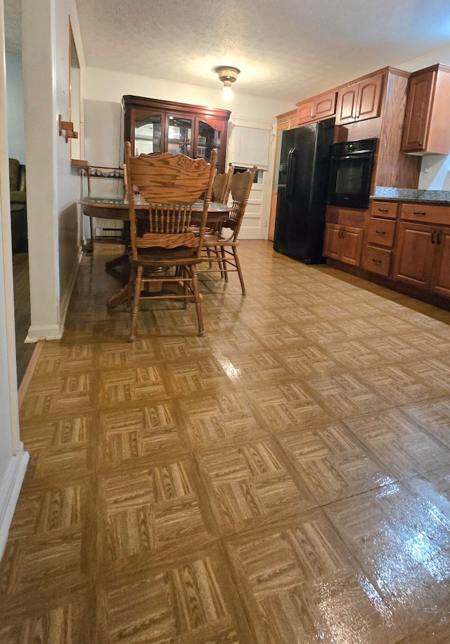 dining room featuring parquet floors