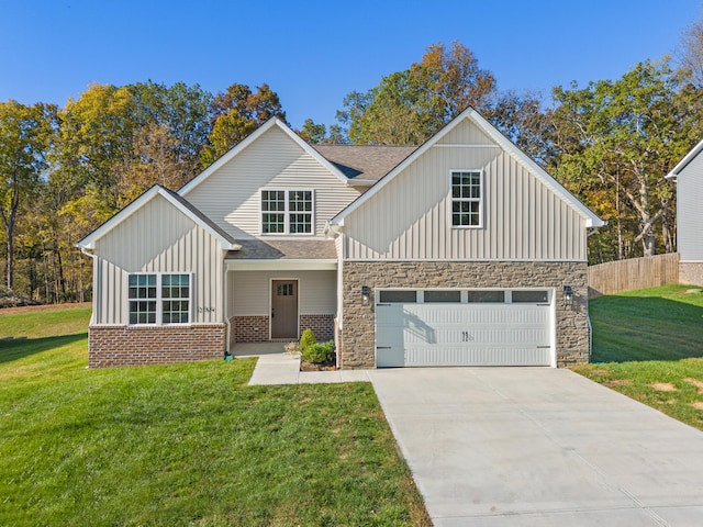 view of front of property featuring a front yard and a garage