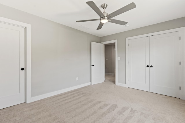 unfurnished bedroom with light carpet and ceiling fan