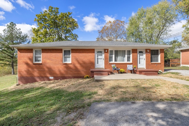 ranch-style house with a front lawn