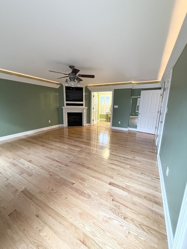 unfurnished living room with ceiling fan and light wood-type flooring