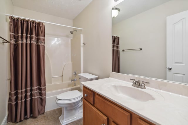 full bathroom featuring shower / bath combo, vanity, tile patterned flooring, toilet, and a textured ceiling