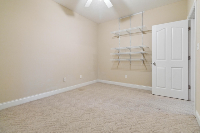 unfurnished room featuring light carpet and ceiling fan