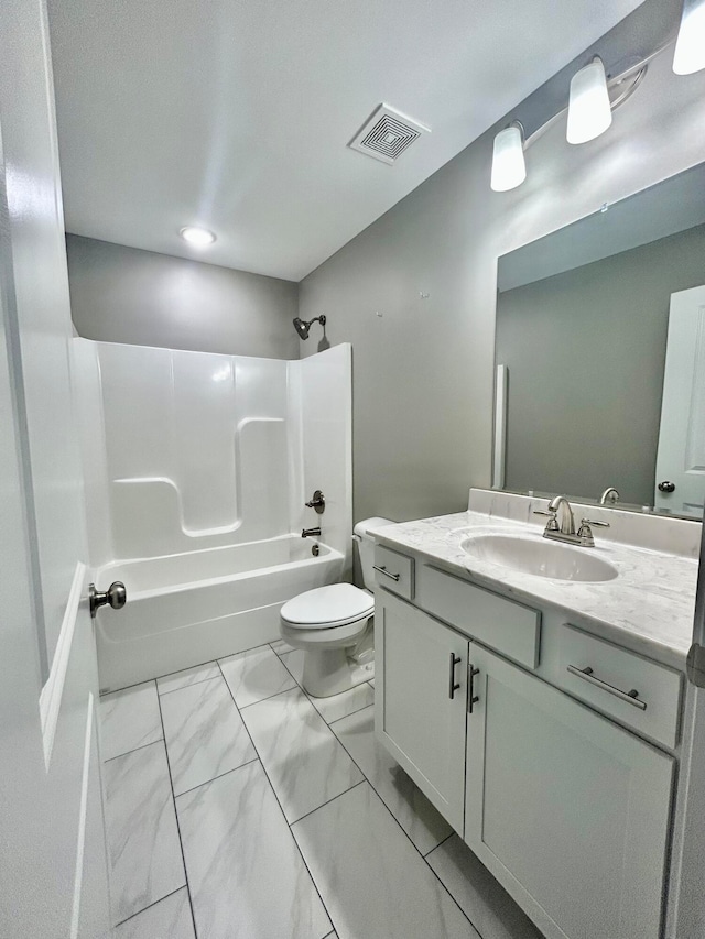 full bathroom with  shower combination, vanity, and toilet