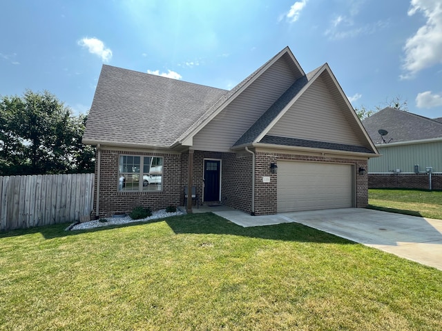 view of front of home with a front yard and a garage