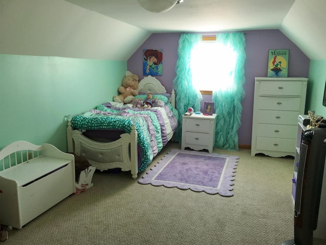 carpeted bedroom with lofted ceiling