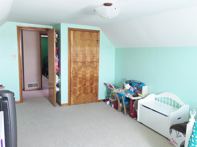 playroom featuring lofted ceiling and light colored carpet