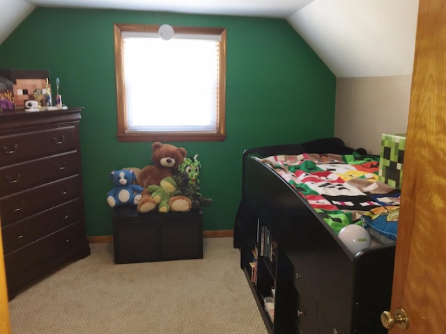 bedroom featuring light carpet and vaulted ceiling