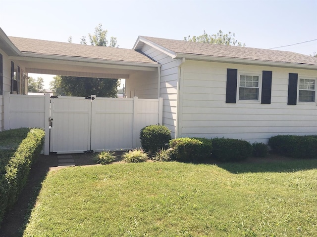 view of property exterior featuring a lawn