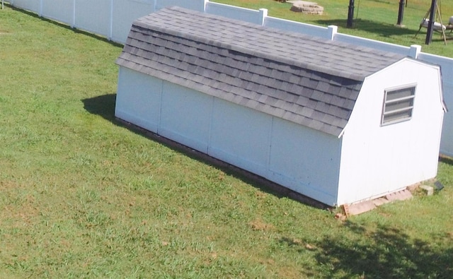 view of outbuilding with a lawn