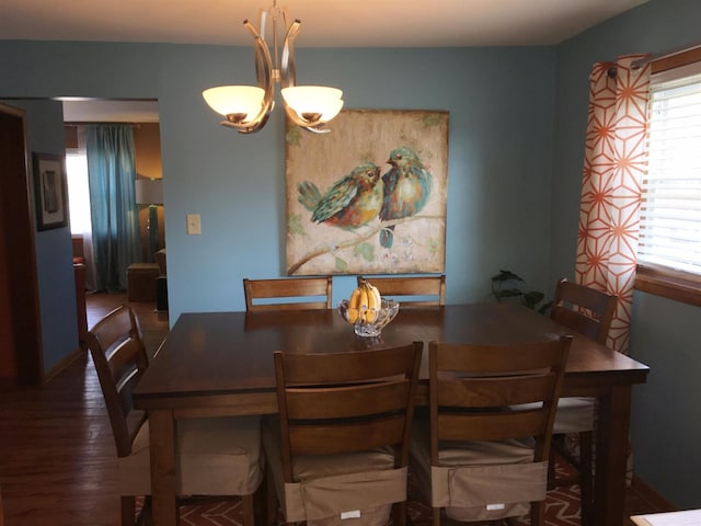 dining area with dark hardwood / wood-style floors