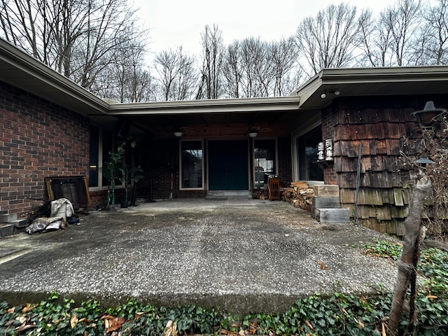 view of exterior entry with covered porch