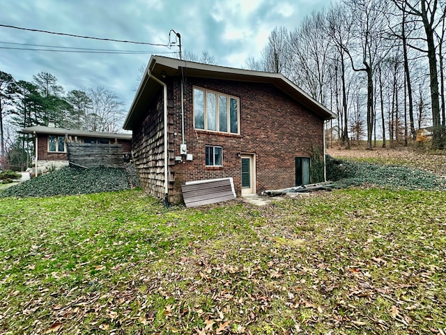 back of house featuring a lawn