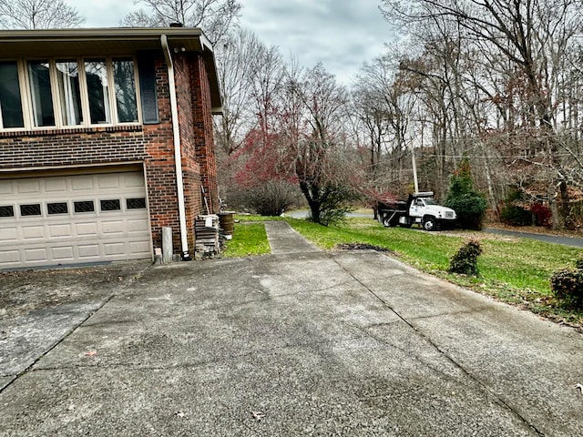 view of side of home featuring a garage