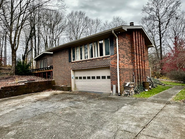 view of side of home with a garage