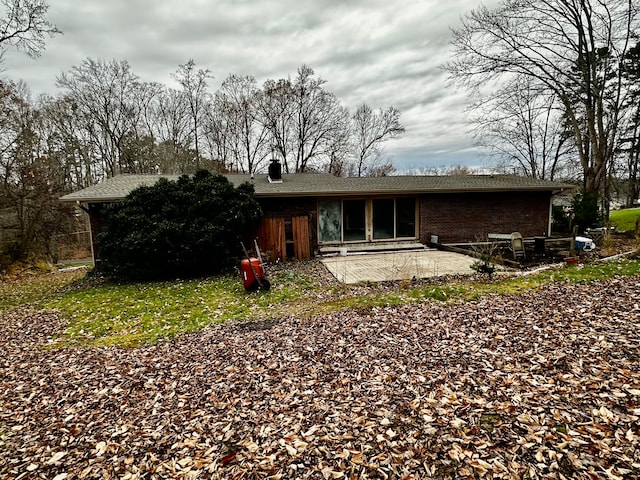 back of house featuring a patio