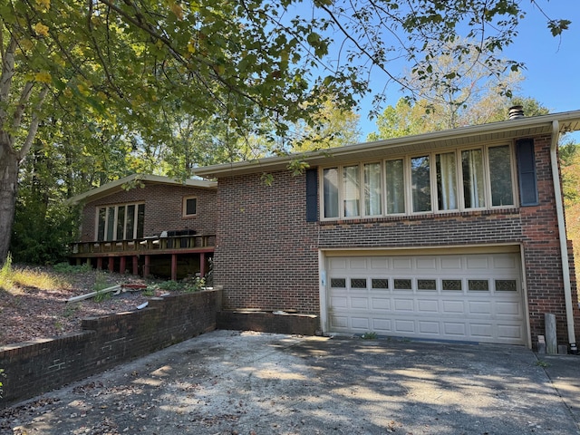 view of front of house with a garage and a deck