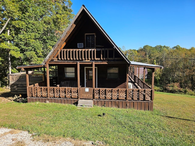 view of front of home with a front yard and covered porch