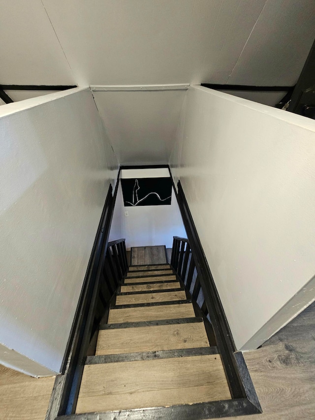 stairway featuring hardwood / wood-style floors