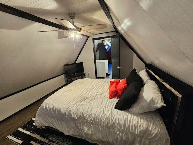 bedroom with hardwood / wood-style flooring, ceiling fan, and vaulted ceiling