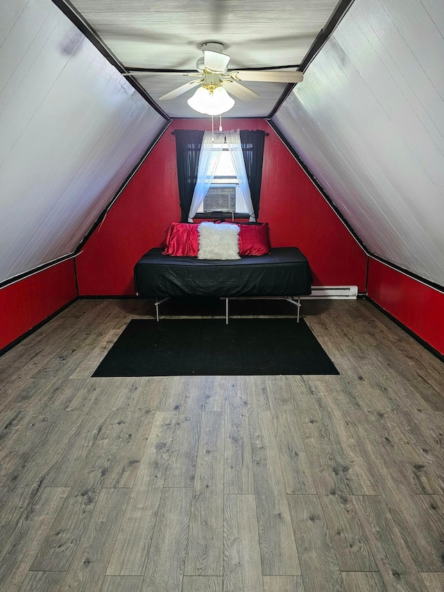 bedroom featuring ceiling fan, wood-type flooring, and vaulted ceiling