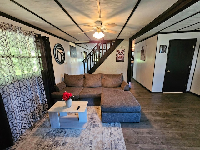 living room featuring ceiling fan and dark hardwood / wood-style floors