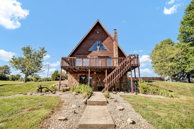 view of front facade featuring a front yard and a wooden deck