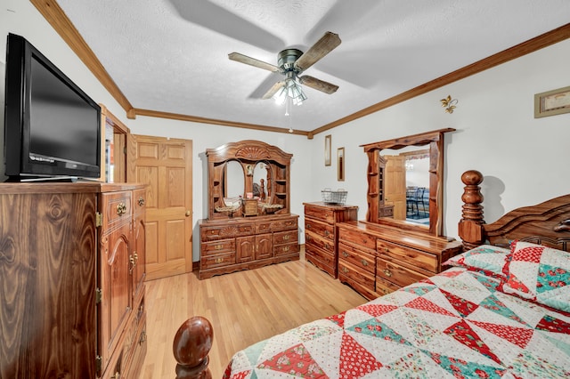 bedroom with ceiling fan, crown molding, wood-type flooring, and a textured ceiling