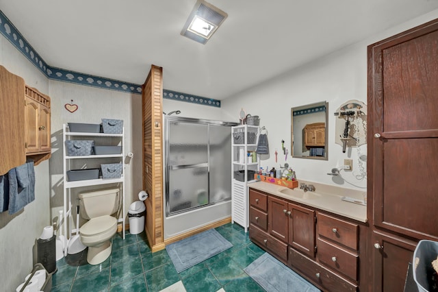 bathroom with vanity, toilet, and tile patterned flooring