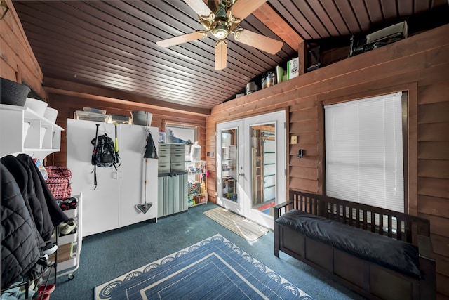 interior space featuring wood ceiling, lofted ceiling, and ceiling fan