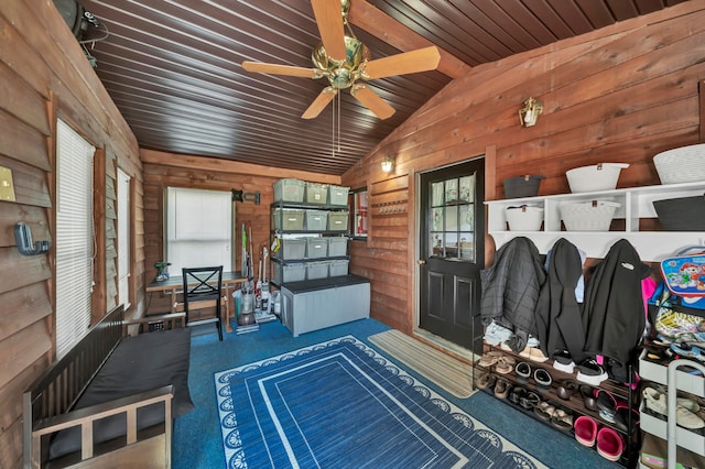 mudroom with vaulted ceiling, wood walls, a wealth of natural light, and wood ceiling