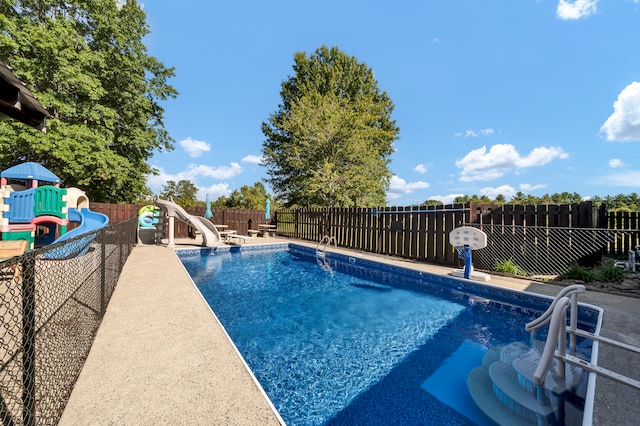 view of pool with a water slide