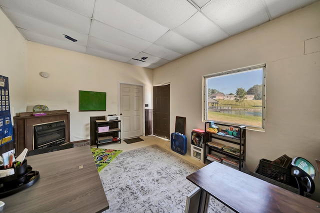 interior space featuring a drop ceiling