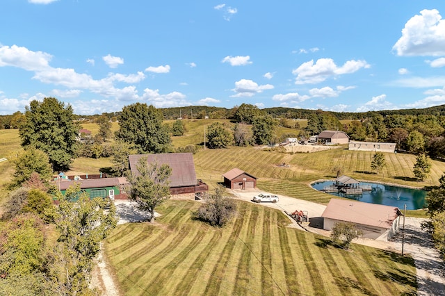 aerial view with a water view and a rural view