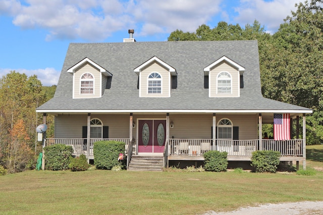 farmhouse-style home featuring a porch and a front lawn