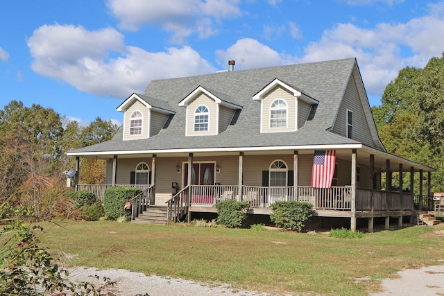 farmhouse with covered porch and a front yard