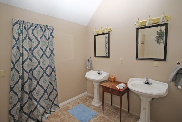 bathroom with vaulted ceiling