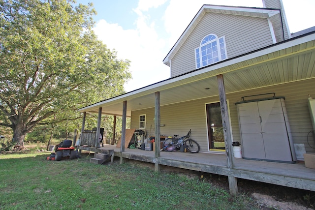 exterior space with a porch and a lawn