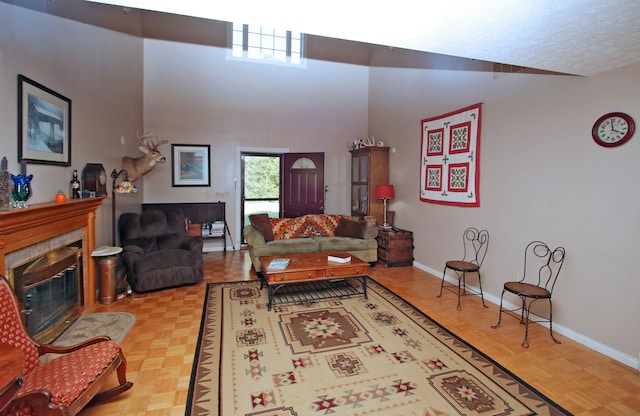 living room with a high ceiling and light parquet flooring