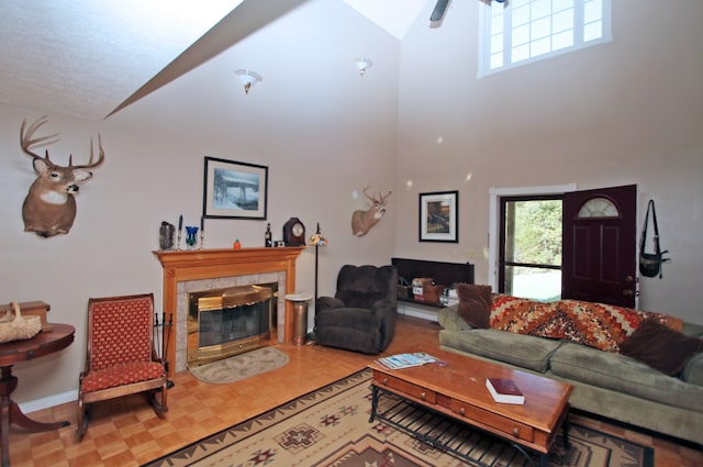 living room featuring high vaulted ceiling and ceiling fan