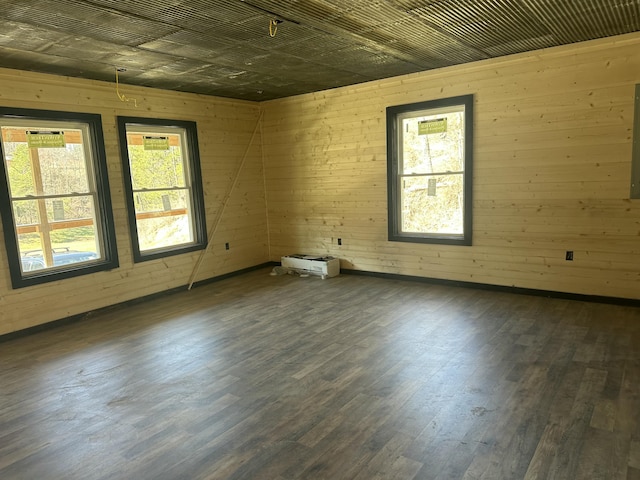 spare room featuring wood finished floors