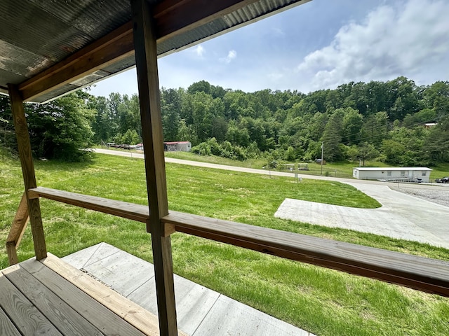 409 Freeman Branch Rd, East Bernstadt, KY 40729 - wooden deck featuring a wooded view and a yard