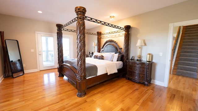 bedroom featuring access to exterior and light hardwood / wood-style floors