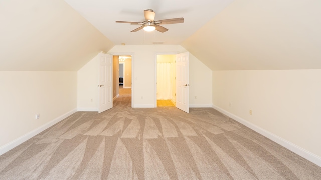 bonus room with light colored carpet, ceiling fan, and lofted ceiling