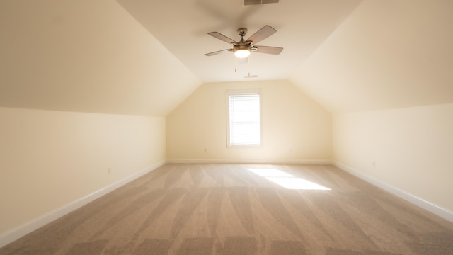 bonus room with light colored carpet, ceiling fan, and lofted ceiling